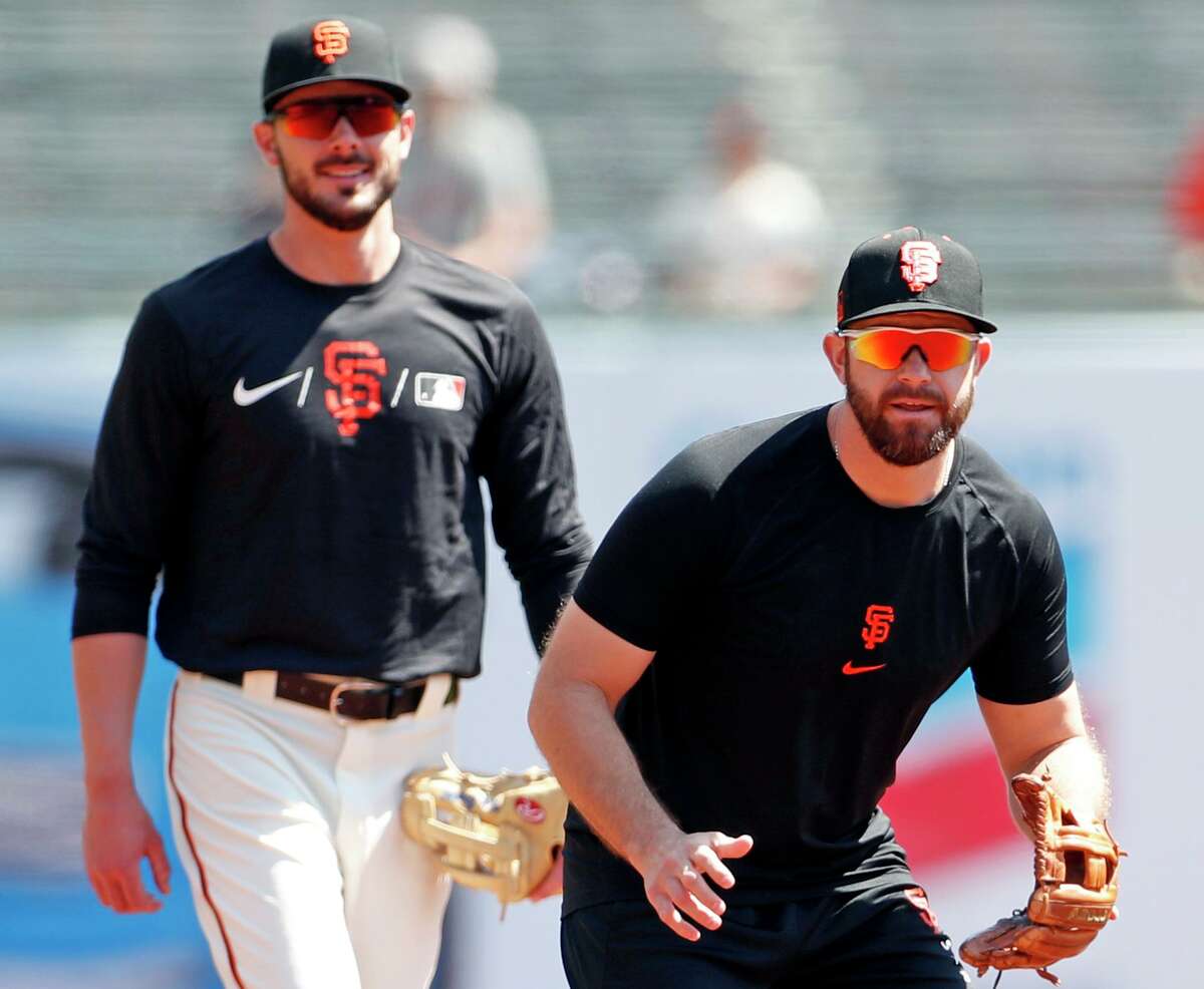San Francisco Giants' Evan Longoria and Kris Bryant before Bryant's first game as a Giant at Oracle Park in San Francisco, Calif., on Sunday, August 1, 2021.