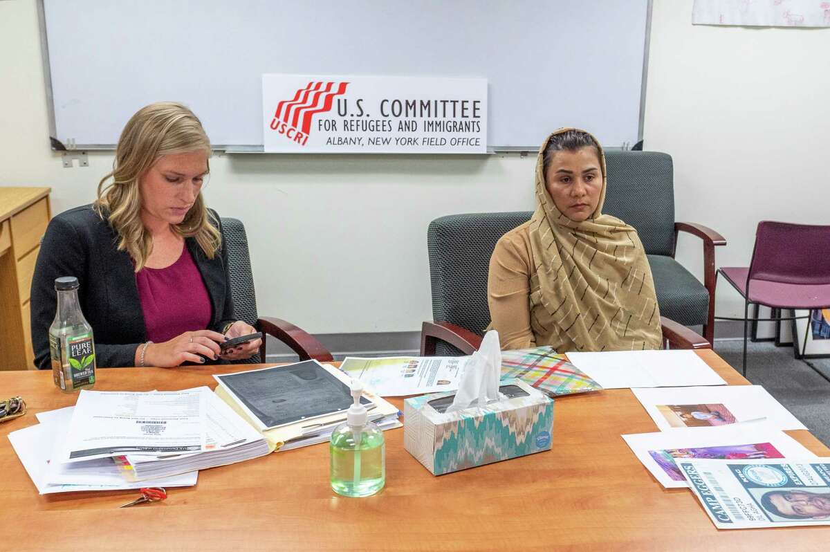 Sara E. Lowry, a staff attorney for the U.S. Committee for Refugees and Immigrants, and Suneeta, talk to media on Sunday, Aug. 15, 2021 about efforts to get Suneeta’s four children out of Afghanistan (Jim Franco/Special to the Times Union.)