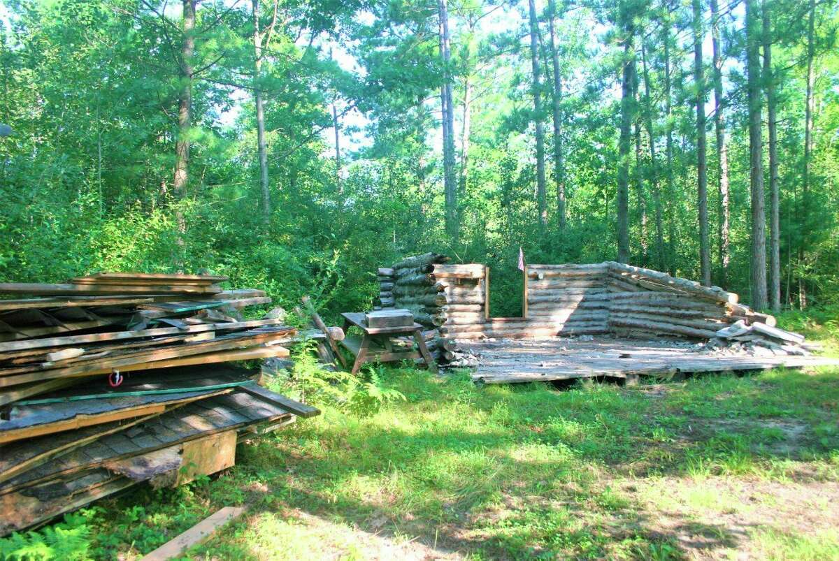 The cabin at the White Pine Valley Recreation Area is being demolished due to concerns over the safety of the structure. Scout leaders with Troop 114 have worked to tear down and remove the structure. (Pioneer photo/Cathie Crew)