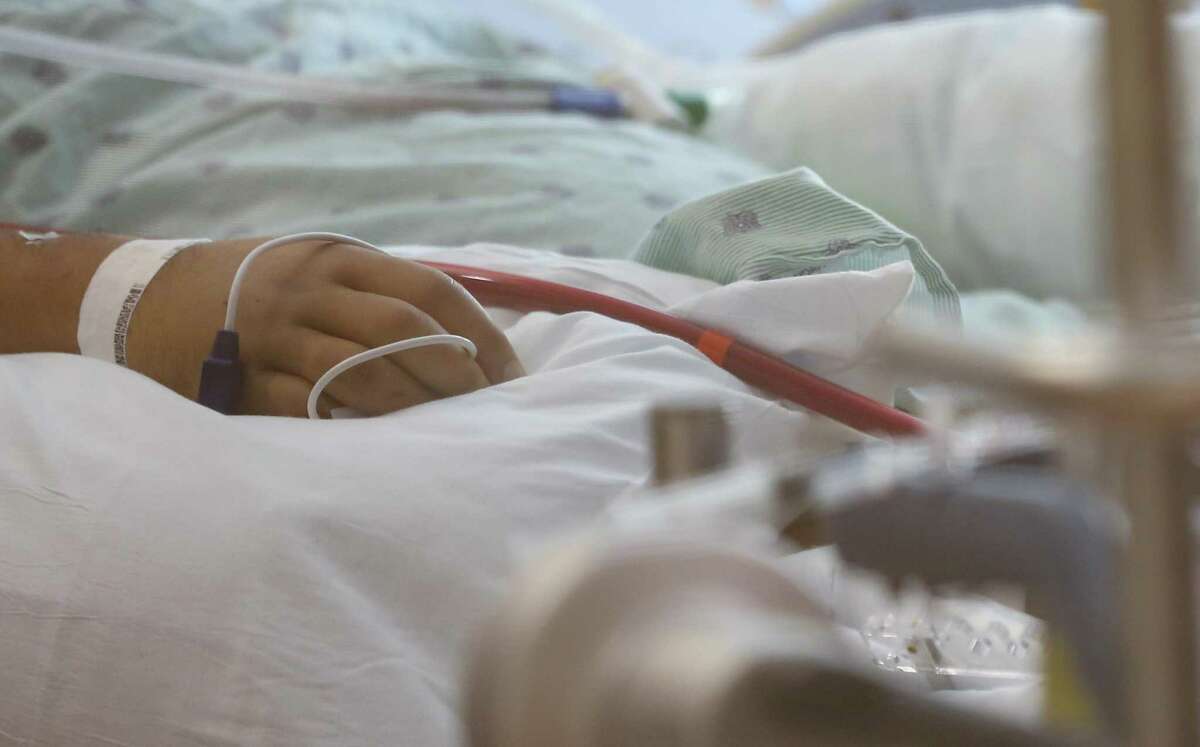 A COVID-19 patient at UTMB Galveston's ICU on Wednesday, Aug. 11, 2021. Hospitals are seeing younger and sicker patients in this latest surge.