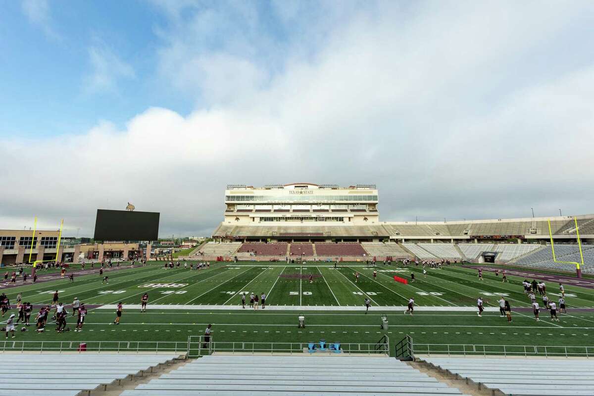 Texas State University’s football team warms up for an inter-squad scrimmage on Saturday, August 14, 2021, in San Marcos, TX. (Jordan Vonderhaar/Contributor)