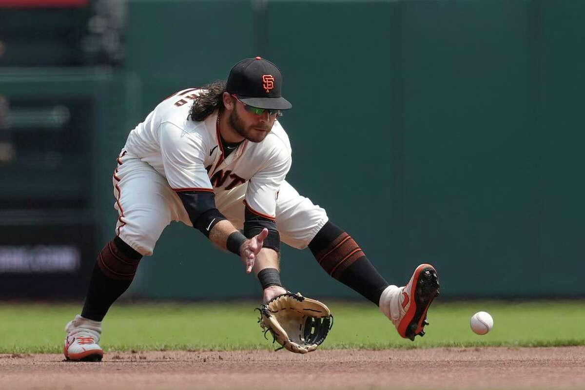 San Francisco Giants shortstop Brandon Crawford fields a groundout hit by Colorado Rockies' Connor Joe during the first inning of a baseball game in San Francisco, Sunday, Aug. 15, 2021. (AP Photo/Jeff Chiu)