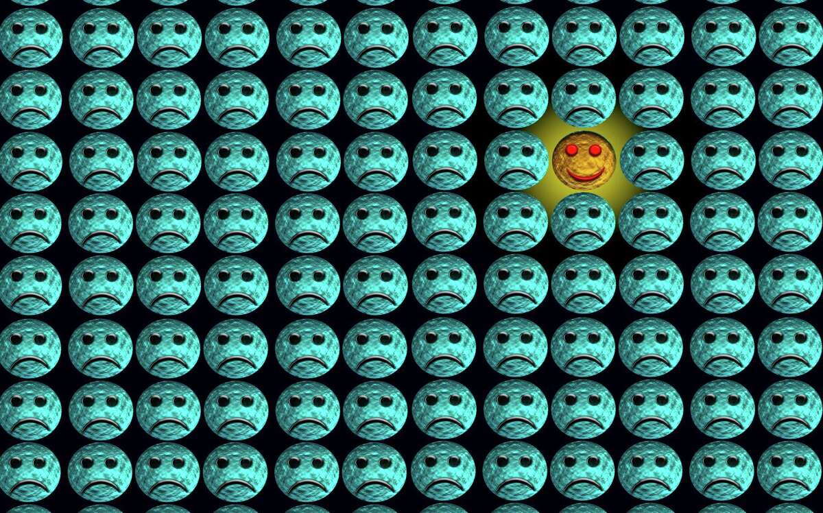 Rows of blue sad faces and one smiley face.
