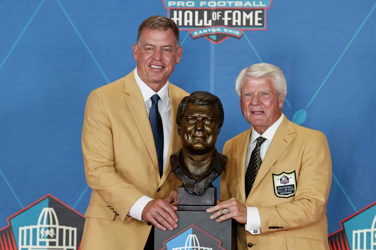 Jimmy Johnson, a member of the Pro Football Hall of Fame Centennial Class, right, poses with his presente, Troy Aikman, during the induction ceremony at the Pro Football Hall of Fame on Saturday, Aug. 7, 2021, in Canton, Ohio. (Ron Schwane/Pool/Getty Images/TNS)
