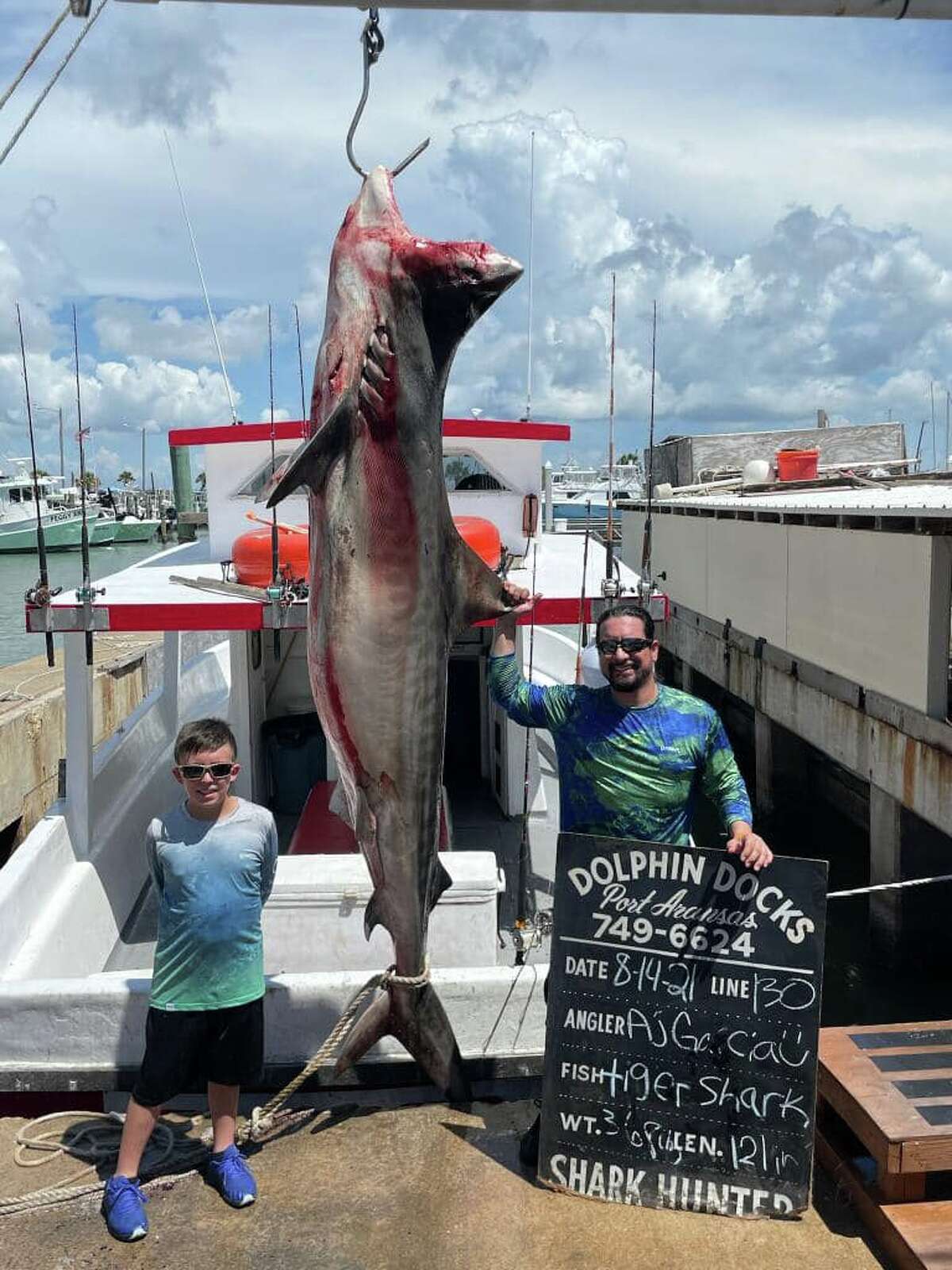 Dolphin Docks Deep Sea Fishing tells MySA.com Aj and Jacob Garcia from San Antonio caught a 10-foot, 368-pound tiger shark while out fishing on a four-hour trip in Port Aransas on Saturday.