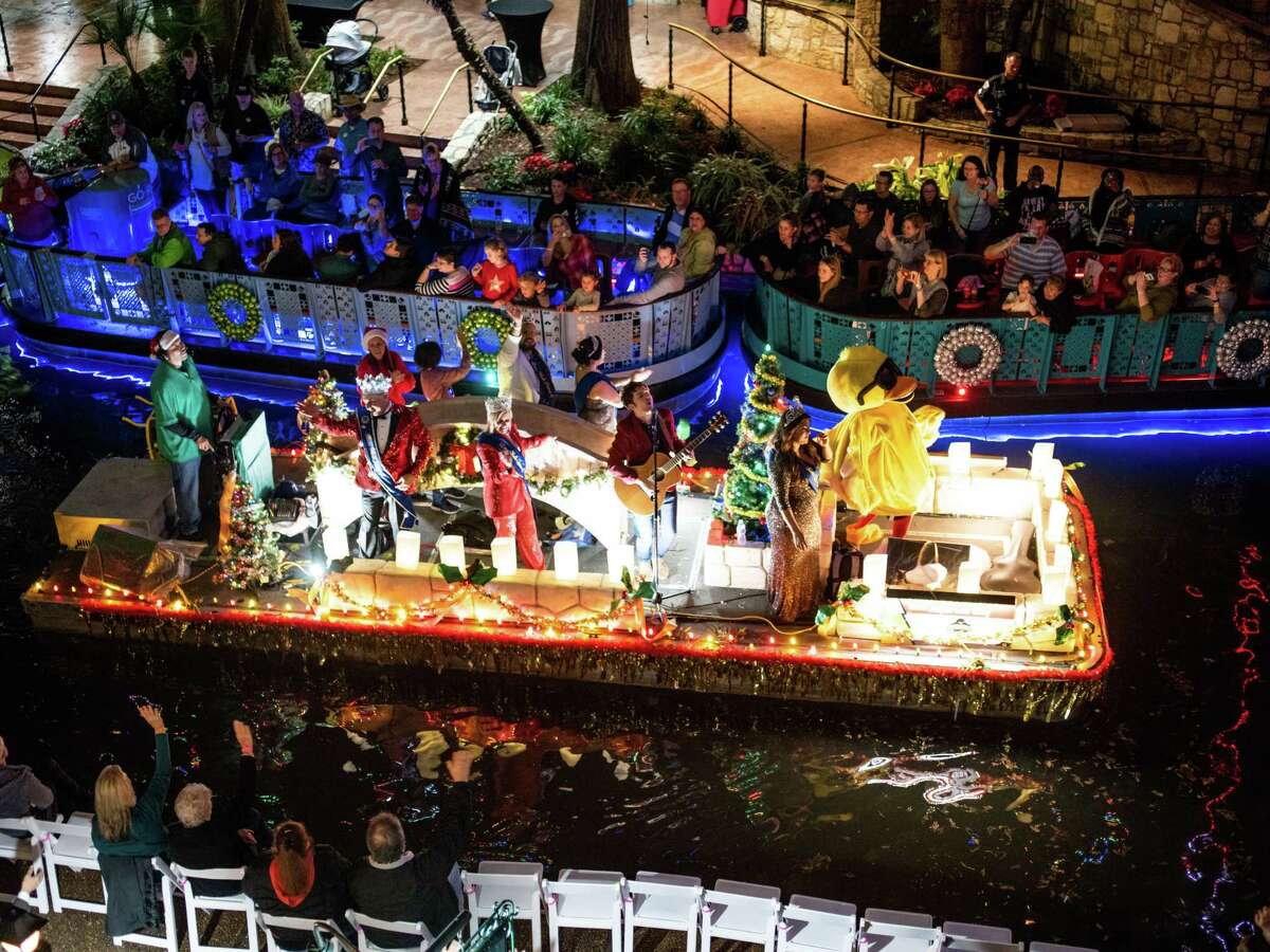A musical float makes its way down the river during the Ford Holiday River Parade on the Riverwalk in downtown San Antonio, Texas on Friday, November 29, 2019. Billy Gibbons of ZZ Top was this year?•s grand marshal.