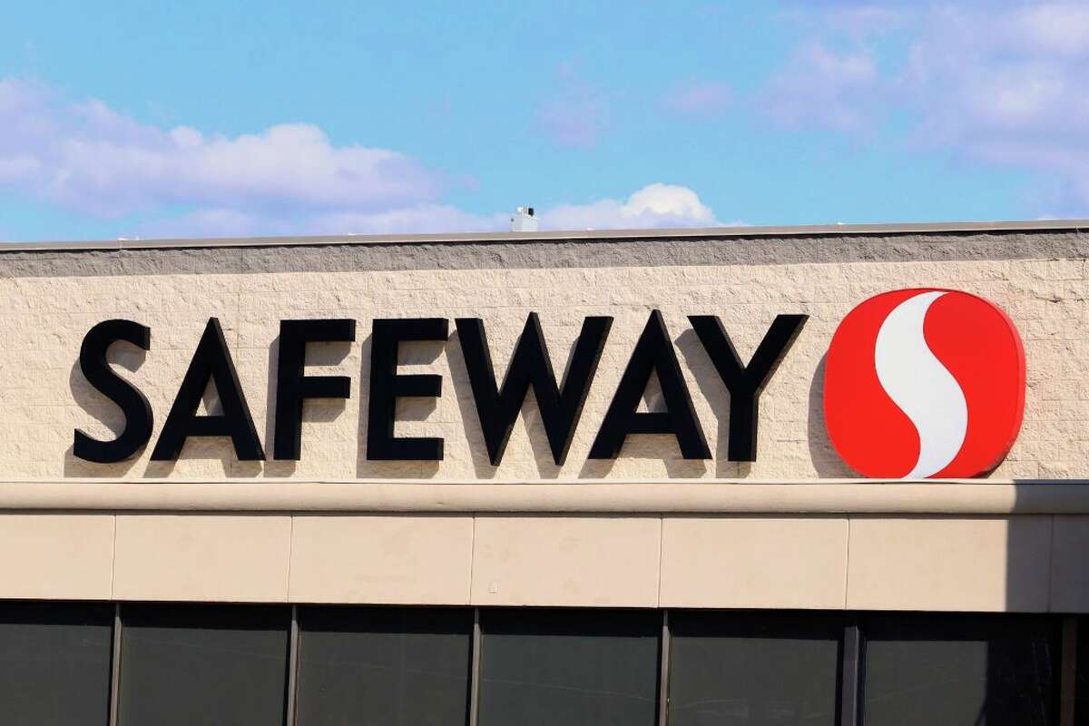 A Safeway sign above a store entrance.