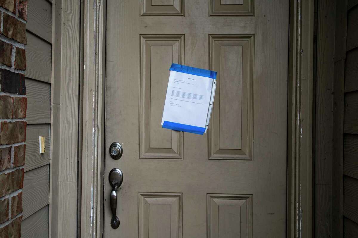 Eviction notice taped on the front door of a property intended for Carroll Shelton Richardson from his landlord Thursday, Sept. 24, 2020, in Houston.