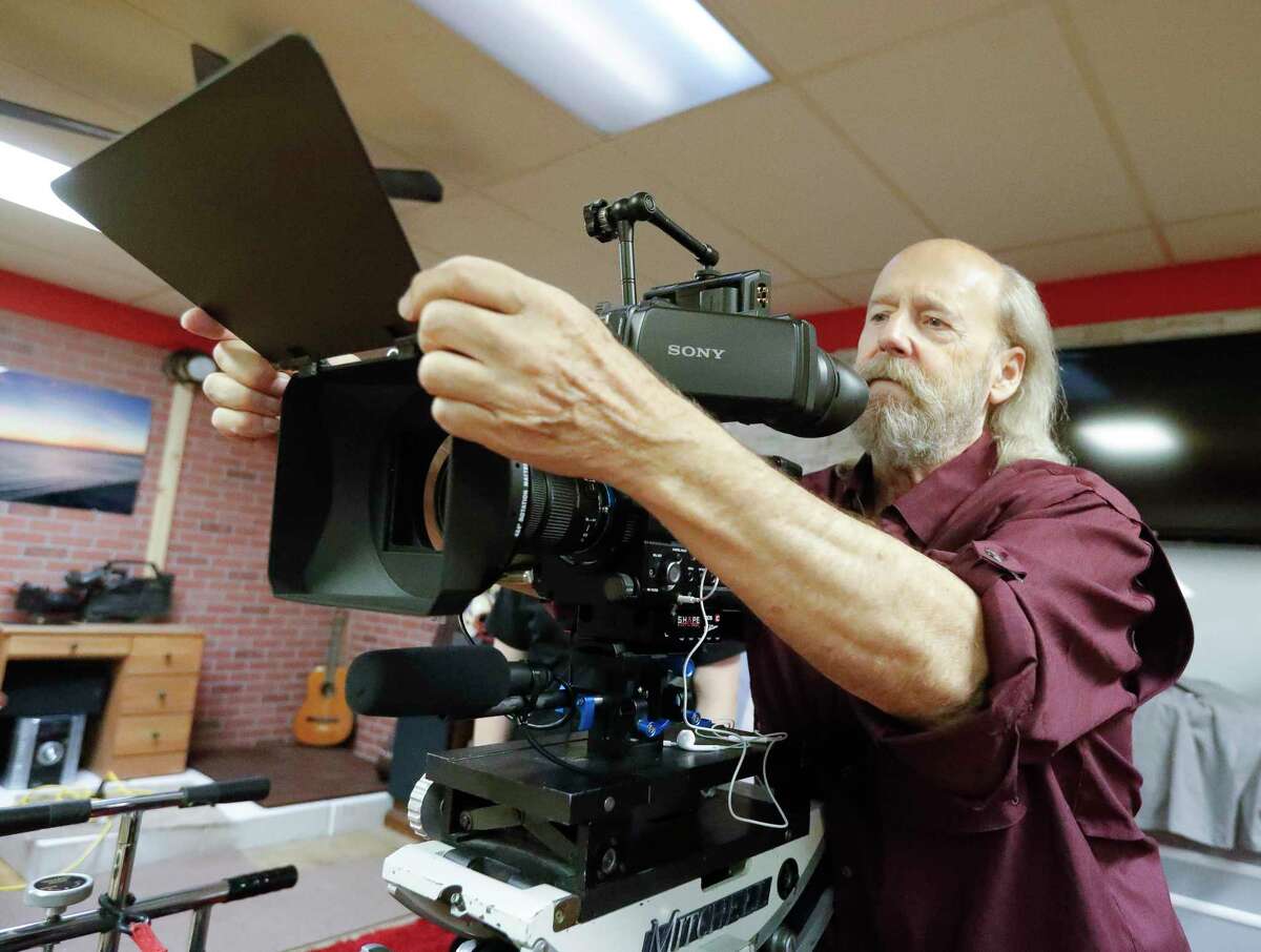 Film instructor Gary Parker adjusts the camera for film class’ first movie “Escape from Film School” at the Indie Film Foundation Studio, Saturday, July 31, 2021, in Conroe. Parker, a member of the Rotary Club of Lake Conroe, was named the Rotarian of the Month for the Lake Conroe club. 