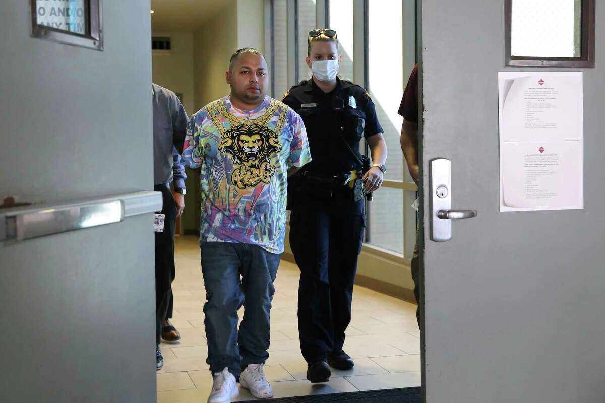 Daniel Barragan is led to the magistrates after his arrest on capital murder charges, Monday, Aug. 16, 2021. San Antonio Police Chief William McManus said Barragan is a suspect in a triple homicide at the Boom Boom Sports Bar on the 1600 block of South New Braunfels early Sunday morning.