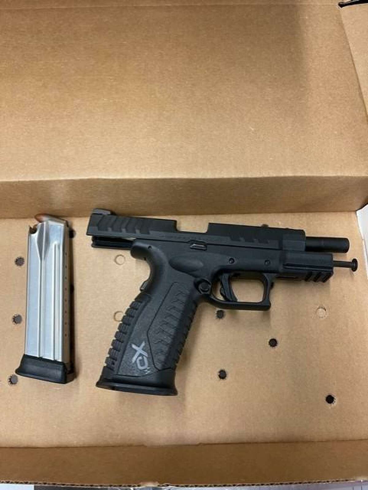 One of the guns seized from a Bridgeport, Conn., business during a search warrant service on Monday, Aug. 16, 2021.
