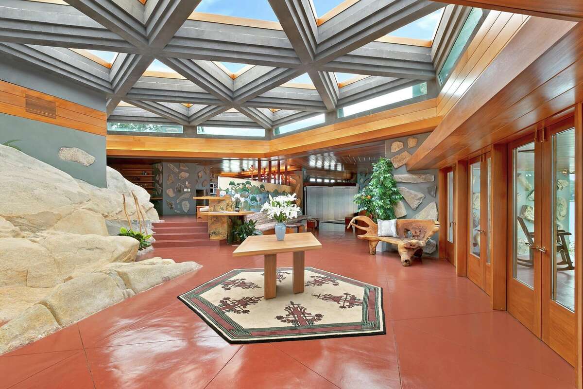 Visitors will be greeted by geometric skylights and exposed rock in the entry hall.