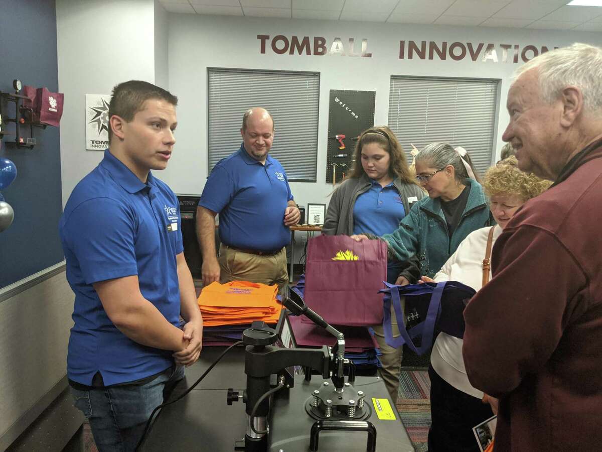 Officials, residents and students attend the grand opening of Lone Star College-Tomball Library's innovation lab. The lab offers the community new equipment and technology including virtual reality, 3D printers, soldering and laser cutting.