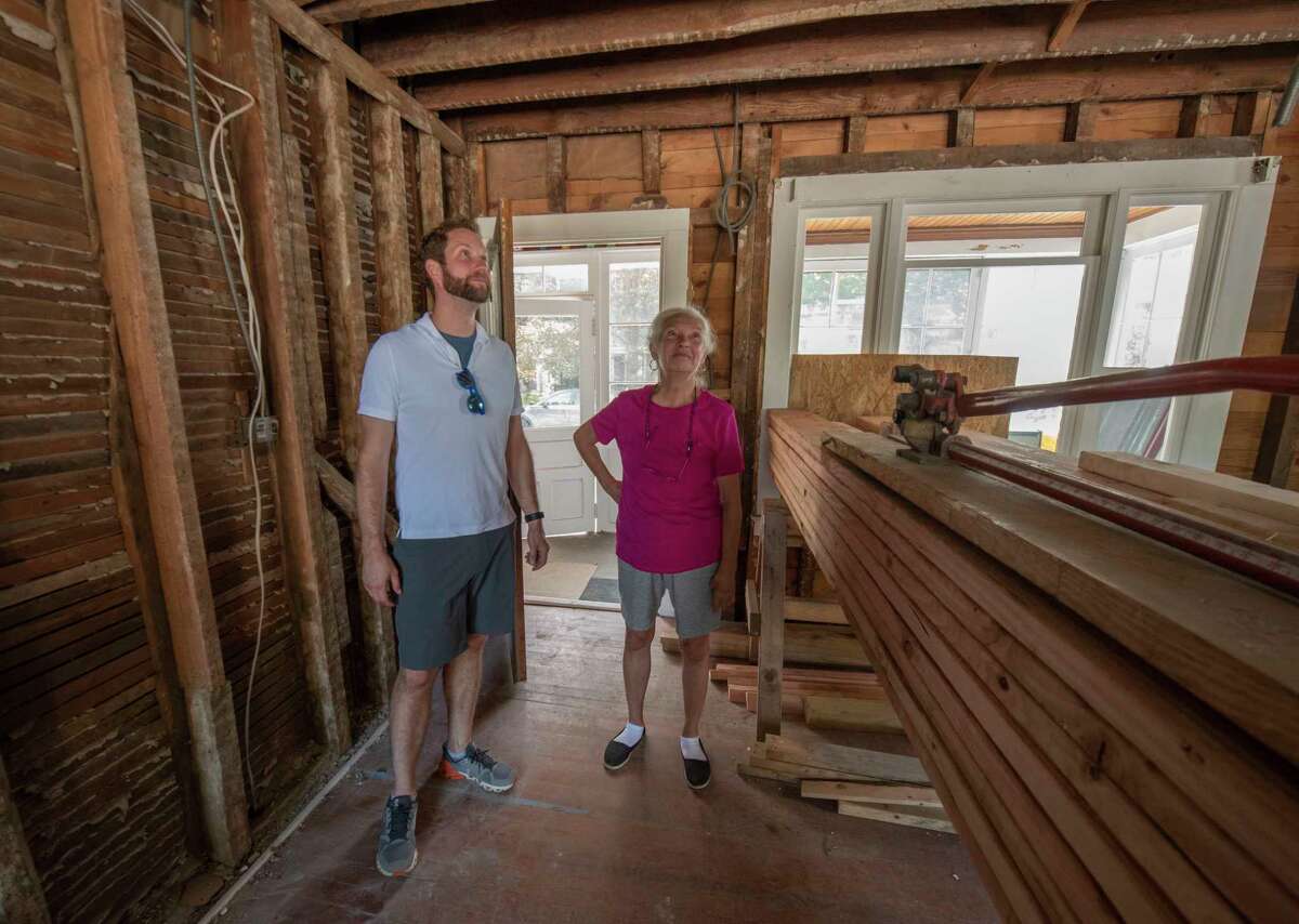 Evan Williamson and his mother Susan Brundige look at the home he and his wife Whitney are renovating in Saratoga Springs. A crew from the reality show “This Old House” is filming the renovation of the home, which has been in the family since 1864.