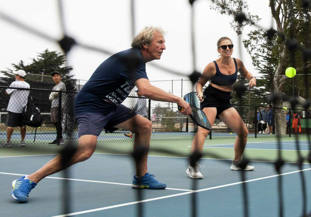 Derrick Marsh and Kate Stoia play pickleball at the courts near Louis Sutter Playground in San Francisco’s McLaren Park. In recent years, there has been an explosion of interest in pickleball, America’s fastest-growing sport.