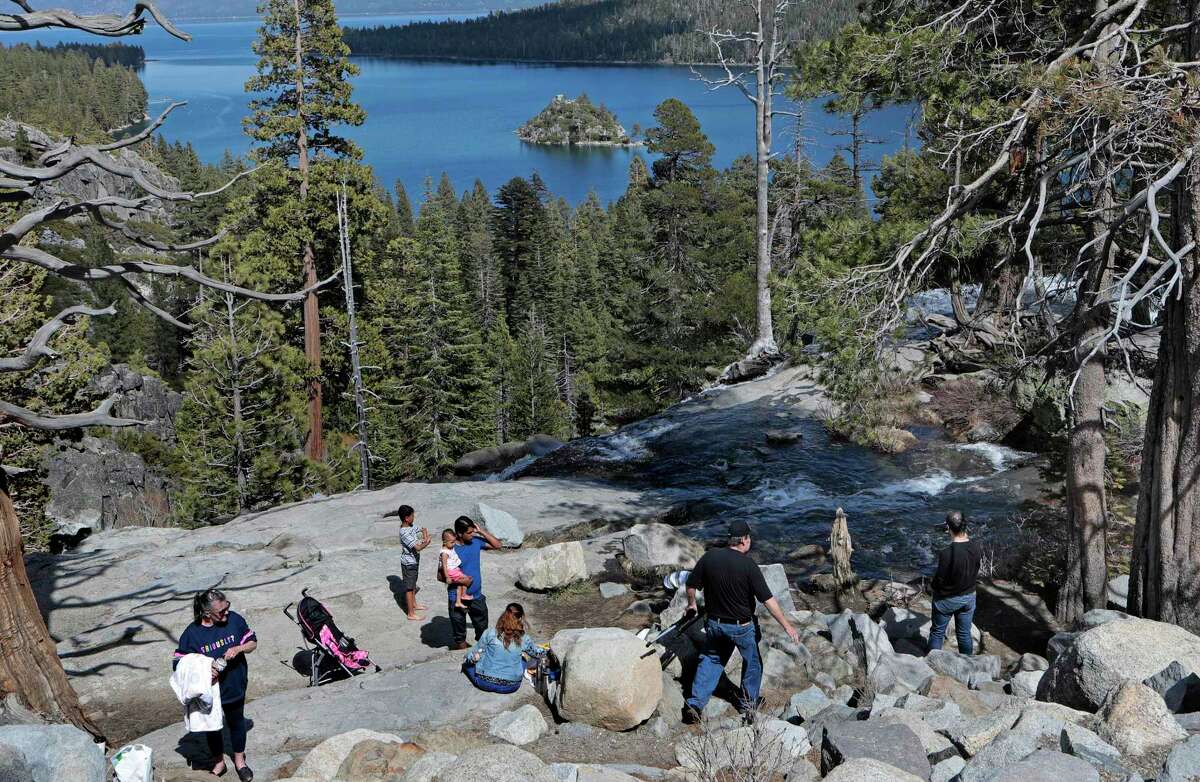 People gather at the Emerald Bay overlook in South Lake Tahoe last year. Campfires are no longer allowed at state parks in much of the High Sierra, including the areas around Lake Tahoe.