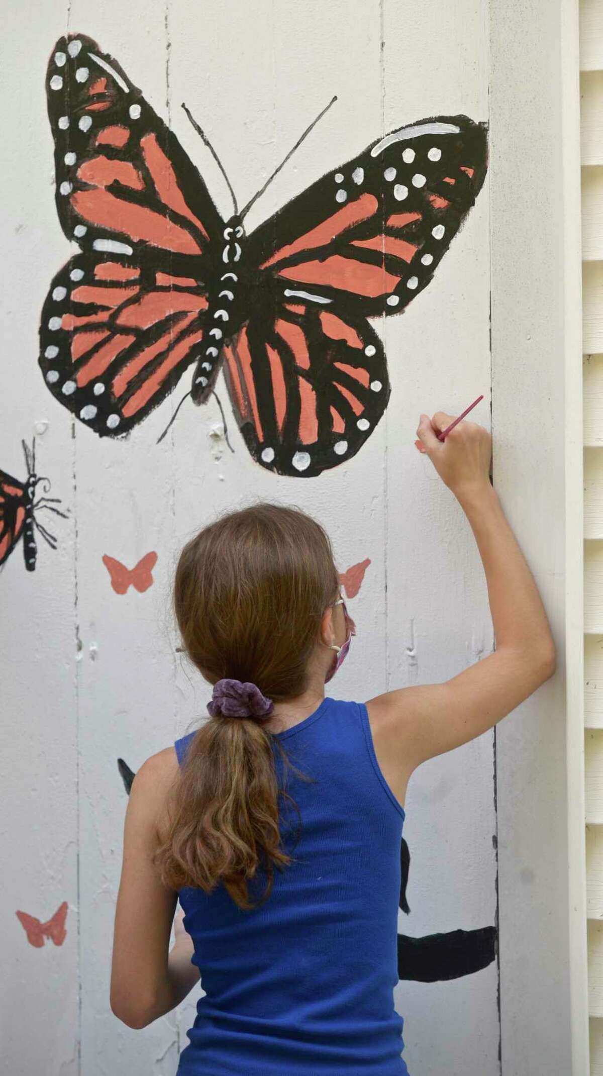 Students in the Ridgefield Guild of Artists’ Summer Arts Program studied species of pollinators that live in the gardens in front the guild and have created murals on the inside and outside of the building. Friday, August 13, 2021; Ridgefield, Conn.