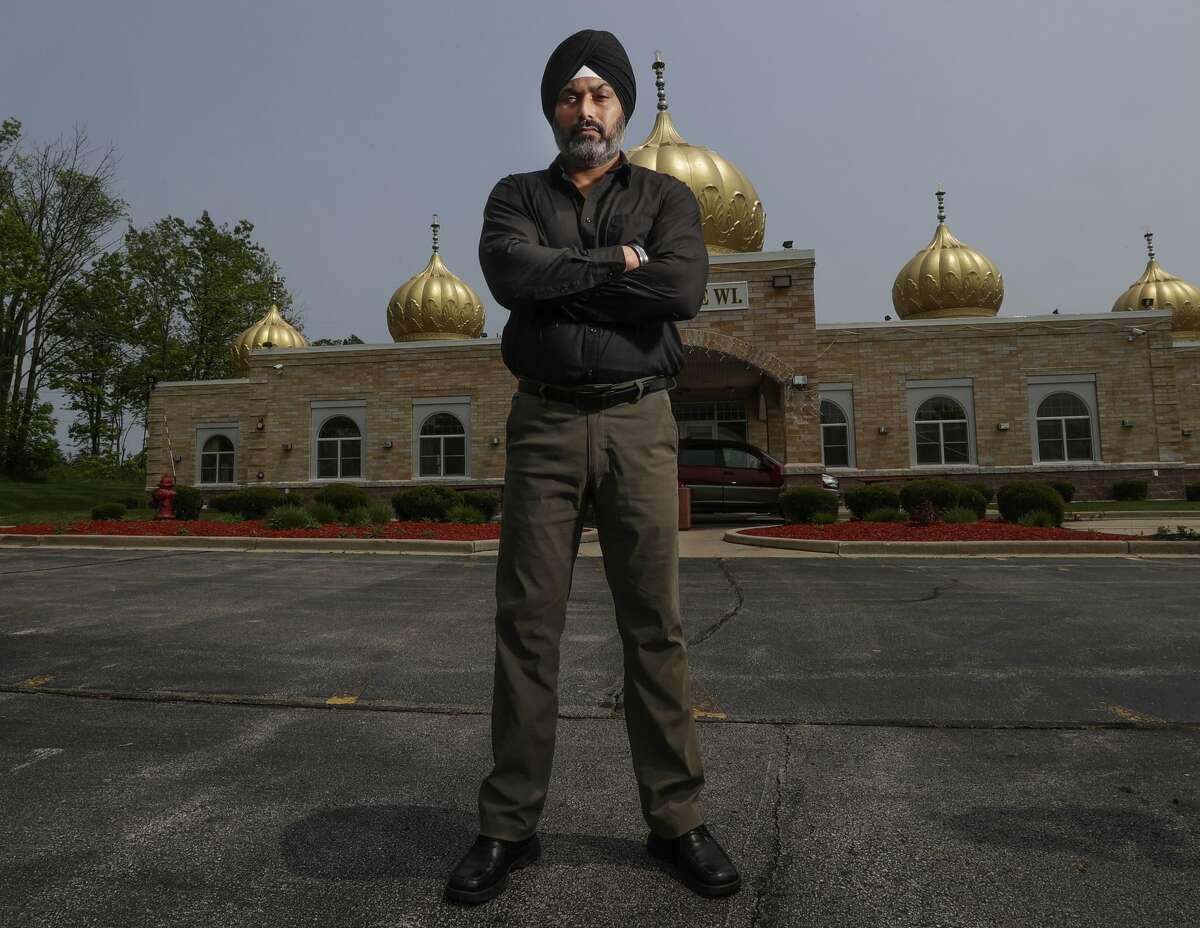 In this Saturday, June 1, 2019 photo, Pardeep Singh Kaleka stands outside the Sikh Temple in Oak Creek, Wis. where Kaleka's father was one of six worshippers murdered  in a 2012 mass shooting.