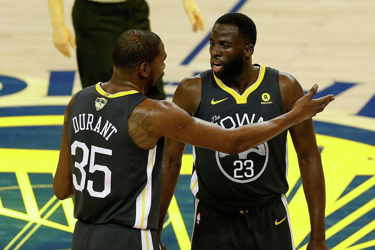 Kevin Durant and Draymond Green talk during 2018 NBA Finals against Cleveland.