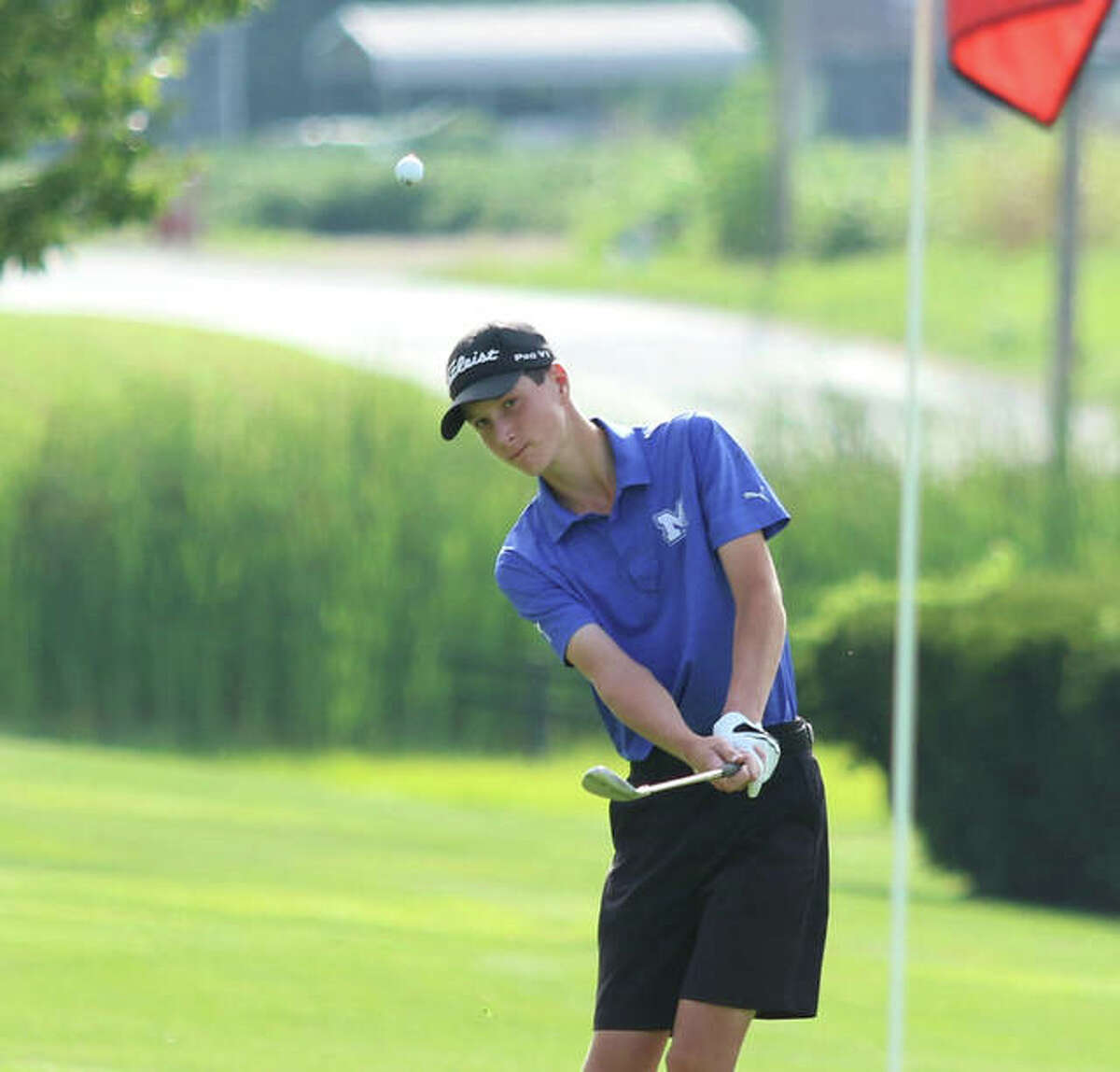 Marquette Catholic’s Aidan O’Keefe chips onto the green on hole No. 2 at the Hickory Stick Invite on Monday at Belk Park in Wood River. O’Keefe shot 71 at Belk and came back Tuesday with a 71 at Spencer T. Olin at the Alton Tee-Off Classic.