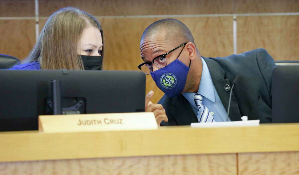 Houston Independent School District superintendent Millard House II (right) chats with Trustee Judith Cruz on Friday, May 21, 2021, in Houston. The HISD board on Thursday will consider proposals to add COVID-related sick days for employees and to offer staff a one-time stipend of $500 for being vaccinated.