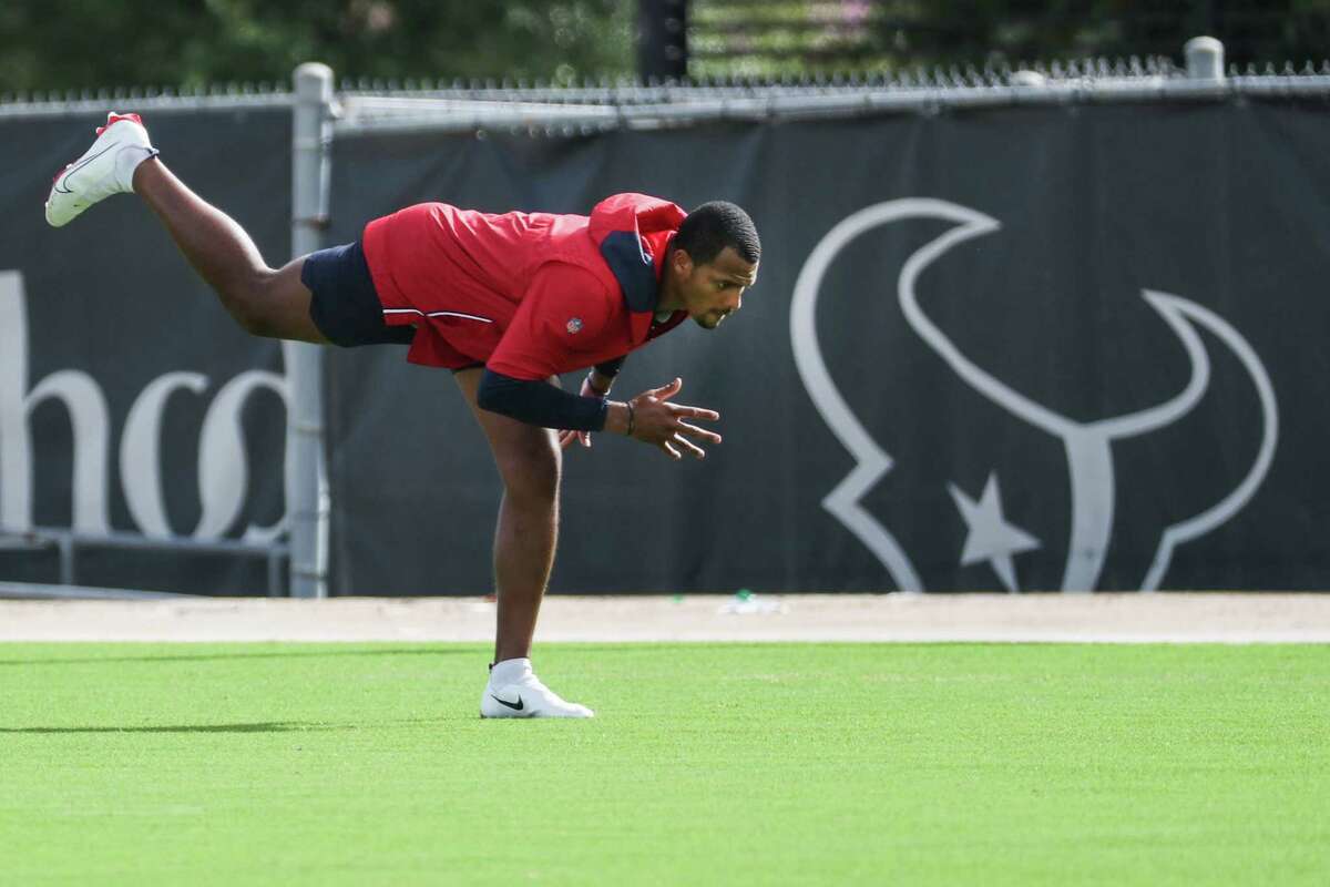 Houston Texans quarterback Deshaun Watson works out on the side during an NFL training camp football practice Thursday, Aug. 19, 2021, in Houston.