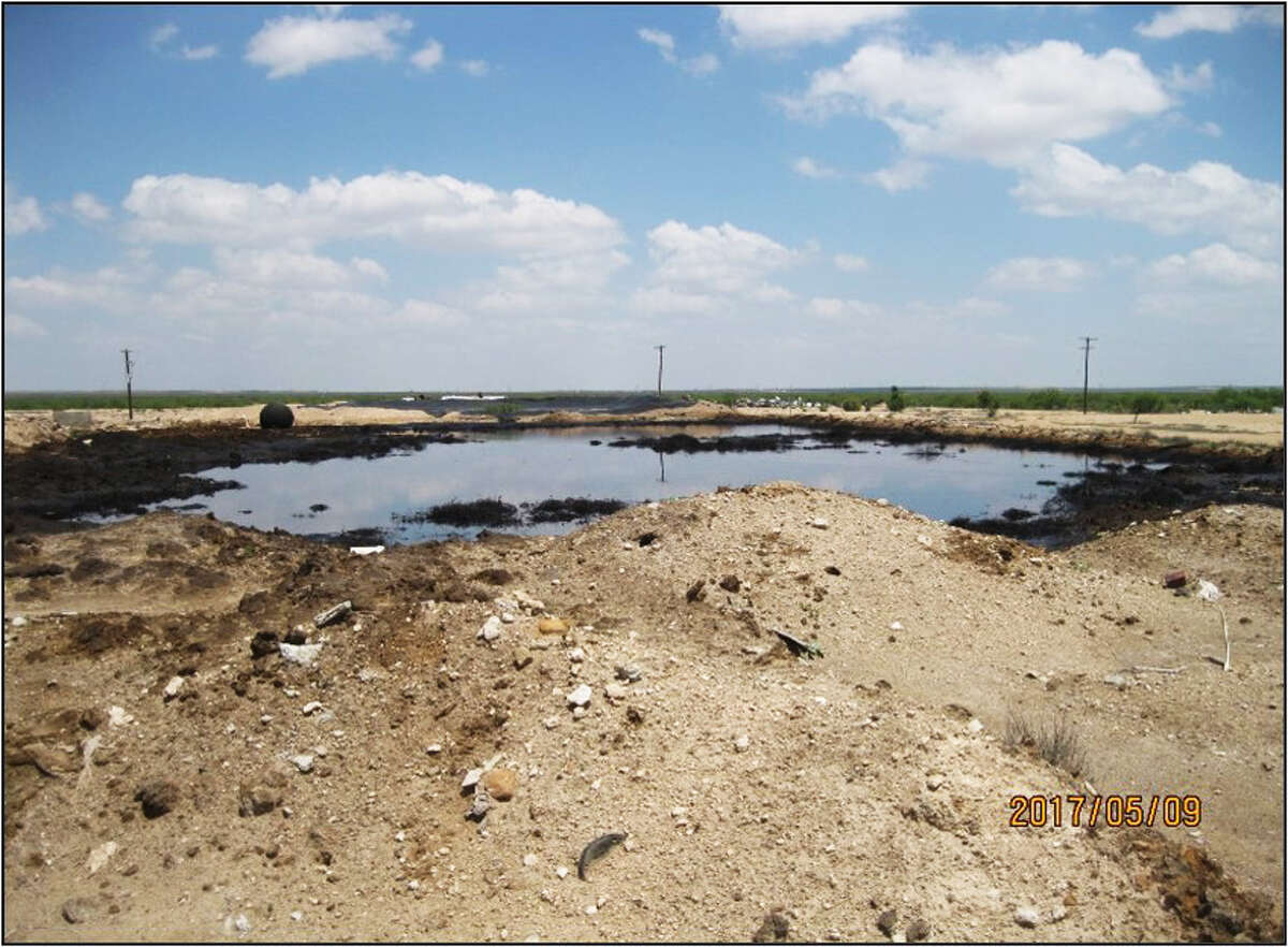 After four years, the Railroad Commission has completed its $9 million clean up of the Wheeler Road Westex Notrees surface waste disposal facility near Odessa. One of the facility's open pits is shown before clean-up.