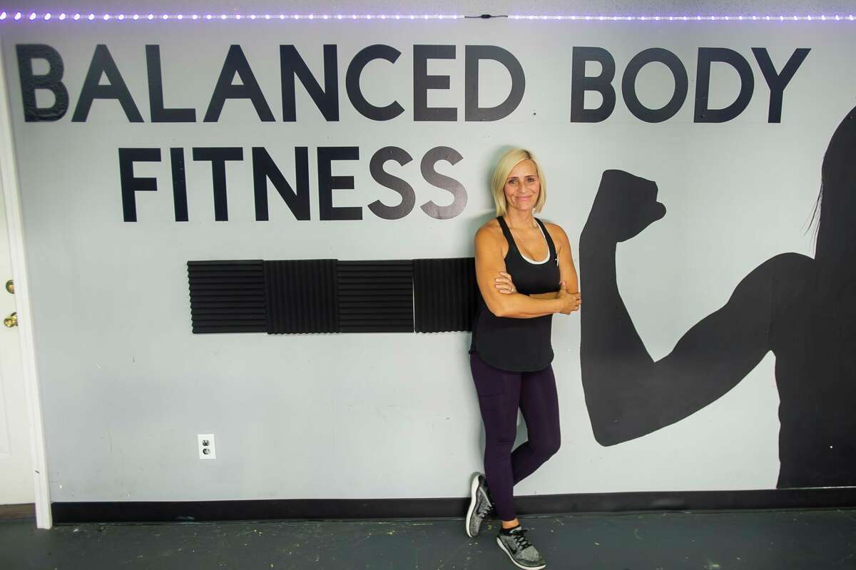 Balanced Body Fitness owner Angela Burse poses for a portrait Thursday inside the gym, located at 154 Saginaw Road in Sanford. (Katy Kildee/kkildee@mdn.net)