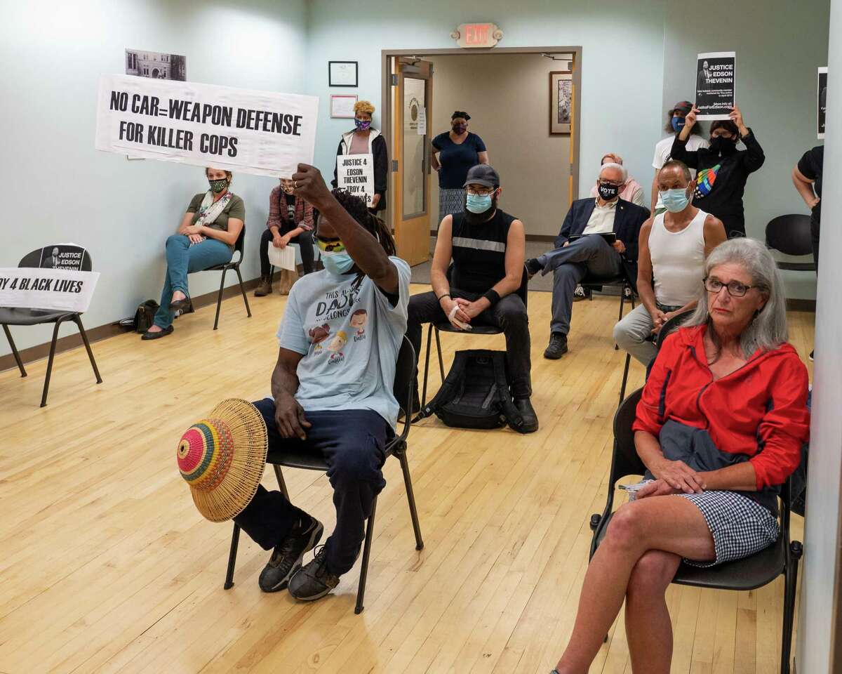 Protesters during a Troy City Council meeting prior to it voting on a court-mediated $1.55 million settlement for the family of Edson Thevenin, a man who was shot and killed by Troy Police Sgt. Randall French during a traffic stop in 2016. (Jim Franco/Special to the Times Union)