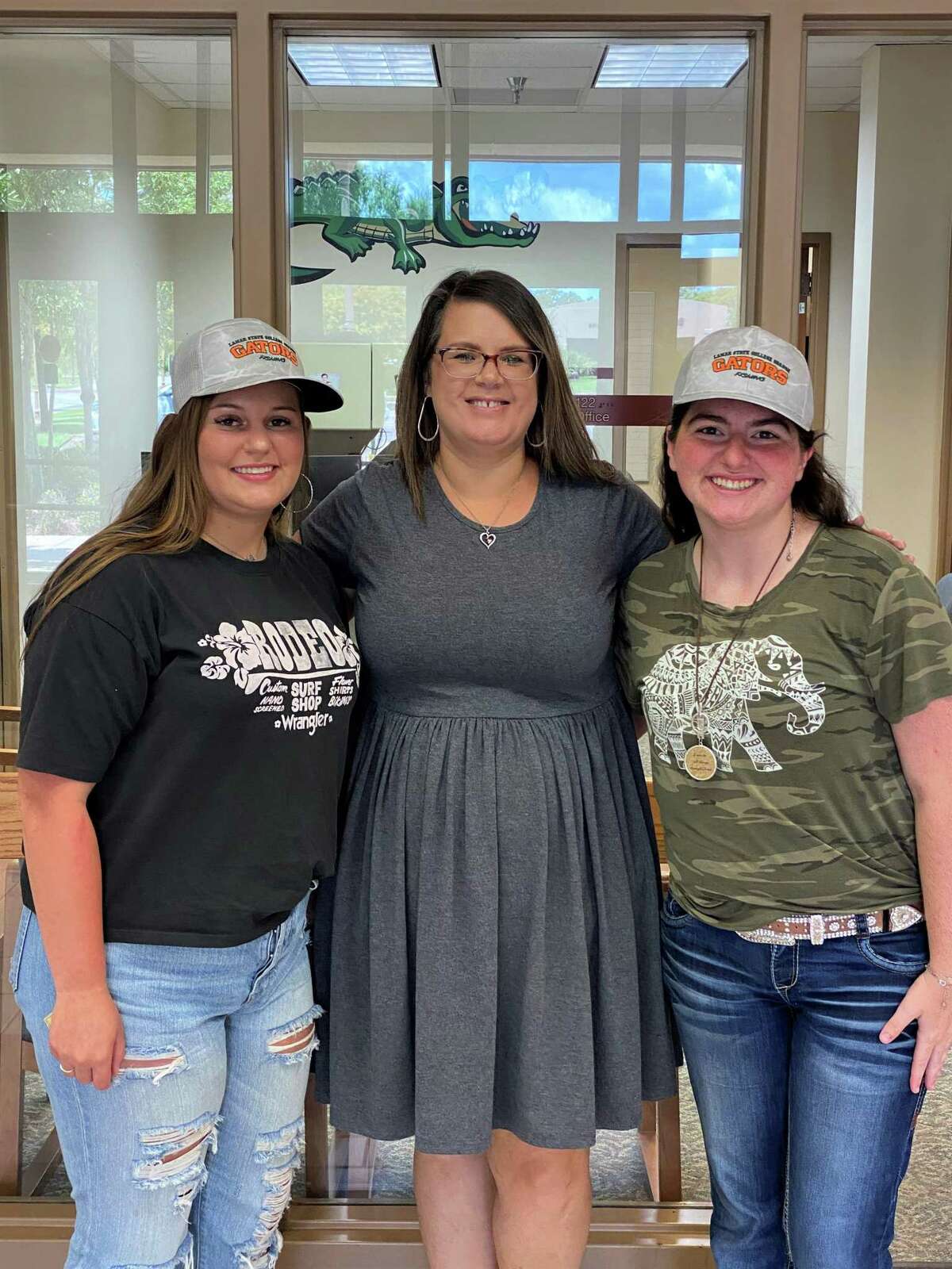Taylor Schroeder (left), Thera Celestine and Gabrielle Woods poses for a picture on campus at Lamar State College Orange. Schroeder and Woods recently became the first female anglers in the LSCO fishing club.
