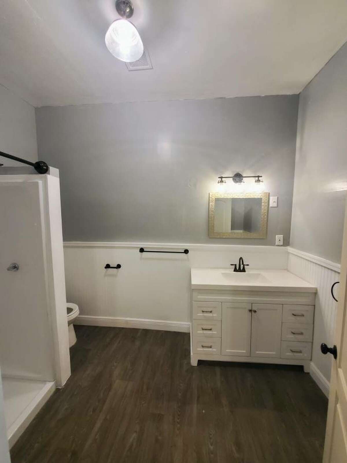 The upstairs bathroom is a little larger than the downstairs bathroom and includes a walk-in shower. 