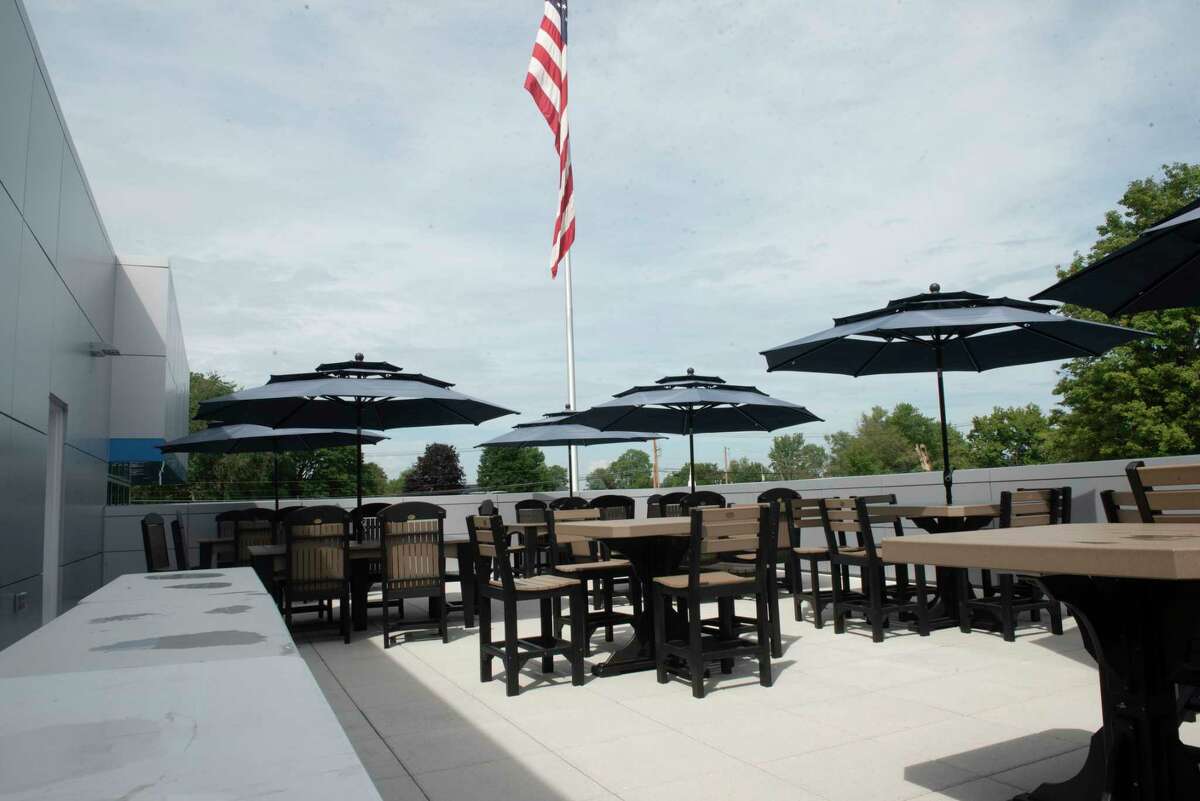 Tables and chairs are set up on a rooftop patio at the new Mohawk Chevrolet on Friday, Aug. 20, 2021 in Ballston Spa, N.Y.