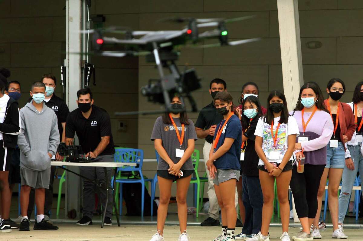A group of 50 incoming high school freshmen in Stamford High School, who've started working towards a technology-focused college degree through the Beyond Limits Summer Scholars Program, attend an unmanned aerial vehicle (UAV) flight demonstration by Aquiline Drones at Mill River Park in Stamford, Conn., on Thursday August 19, 2021. This is the fifth year of the week-long summer program, which is organized and managed by Beyond Limits, a division of the Stamford Peace Youth Foundation, Inc.
