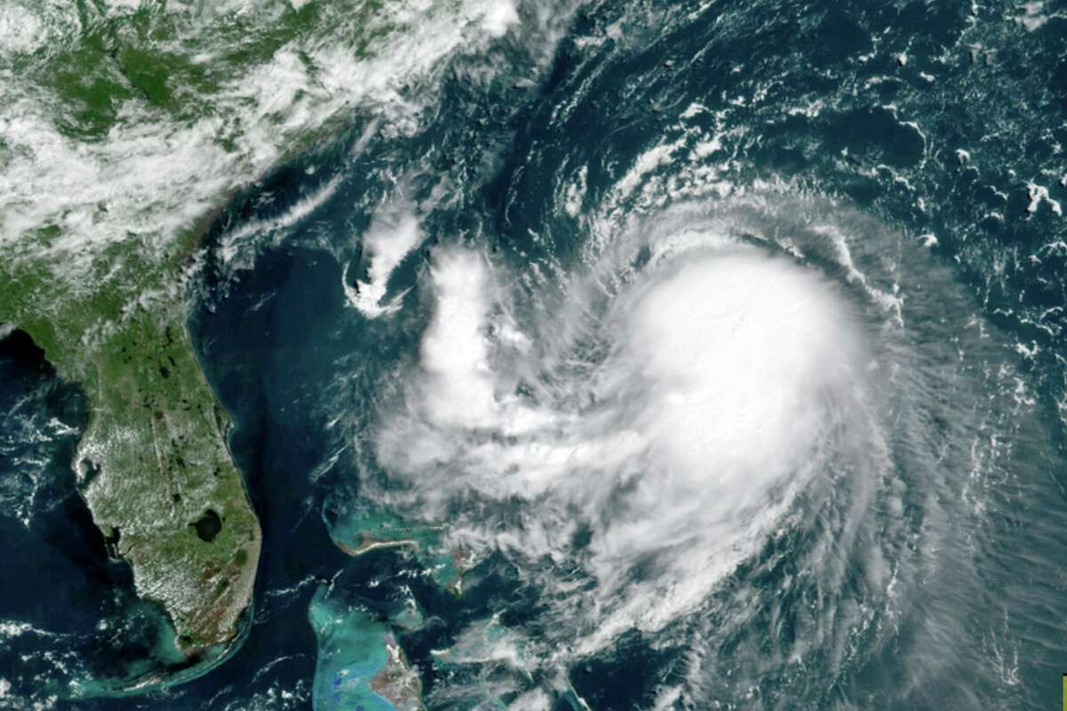 This OES-16 East GeoColor satellite image taken Friday, Aug. 20, 2021, at 11:40 a.m. EDT., and provided by NOAA, shows Tropical Storm Henri in the Atlantic Ocean. Henri was expected to intensify into a hurricane by Saturday, the U.S. National Hurricane Center said. Impacts could be felt in New England states by Sunday, including on Cape Cod, which is teeming with tens of thousands of summer tourists. (NOAA via AP)