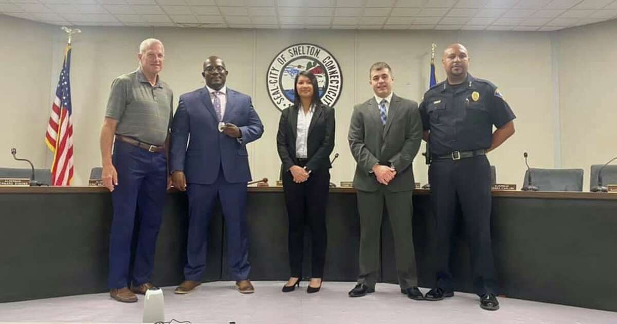 Officers Kamar Gidden (second from left), Cyndy Trinh and Robert Franco flanked by police Chief Shawn Sequeira, were sworn in by Mayor Mark Lauretti (left) at City Hall.