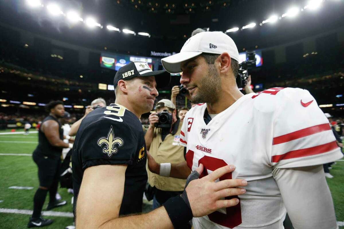 New Orleans Saints quarterback Drew Brees (9) greets San Francisco 49ers quarterback Jimmy Garoppolo (10) after an NFL football game in New Orleans, Sunday, Dec. 8, 2019. The 49ers won 48-46. (AP Photo/Butch Dill)