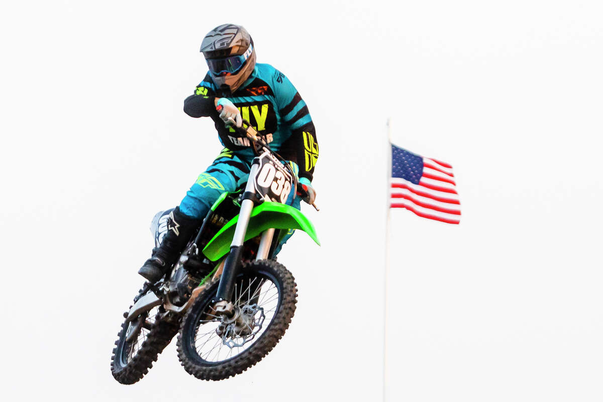 Riders compete in the Supercross event Friday, Aug. 20, 2021 at the Midland County Fairgrounds. (Katy Kildee/kkildee@mdn.net)