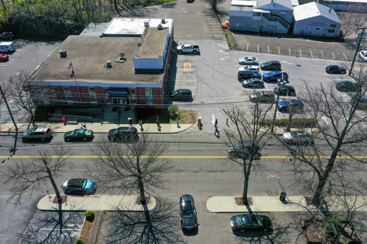 Customers line up outside the Post Office in Darien, CT.