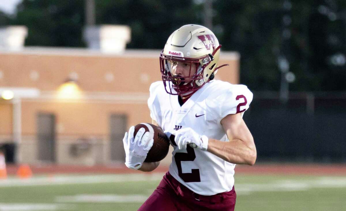 Cypress Woods running back Connor Morris (2) rushes the ball down the field after he catches a pass during the first quarter of a non-district football game against Kingwood at Turner Stadium in Humble, Saturday, Sept. 26, 2020.