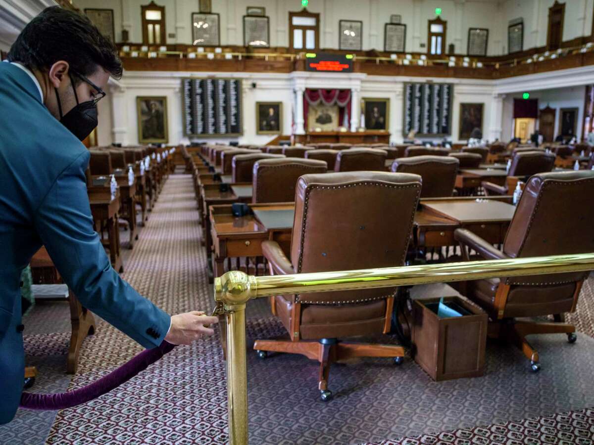 A Texas House aide cordons off the Texas House Floor after the second special session called by Governor Greg Abbott was quickly adjourned due to a lack of a quorum on Saturday, August 7, 2021 in Austin, Tx., U.S. The Texas House of Representatives did not have a quorum due to a number of Texas House Democrats being absent and adjourned quickly after opening the session on Saturday afternoon.