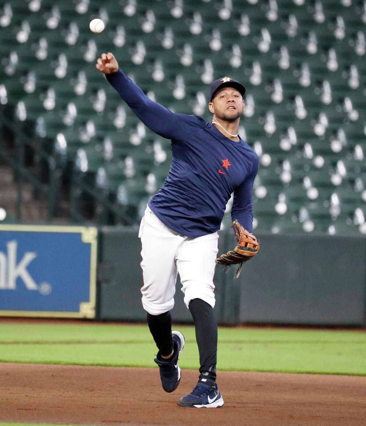 Houston Astros first baseman Yuli Gurriel (10) throws from third base during infield drills before the start of an MLB baseball game at Minute Maid Park, Saturday, August 21, 2021, in Houston.