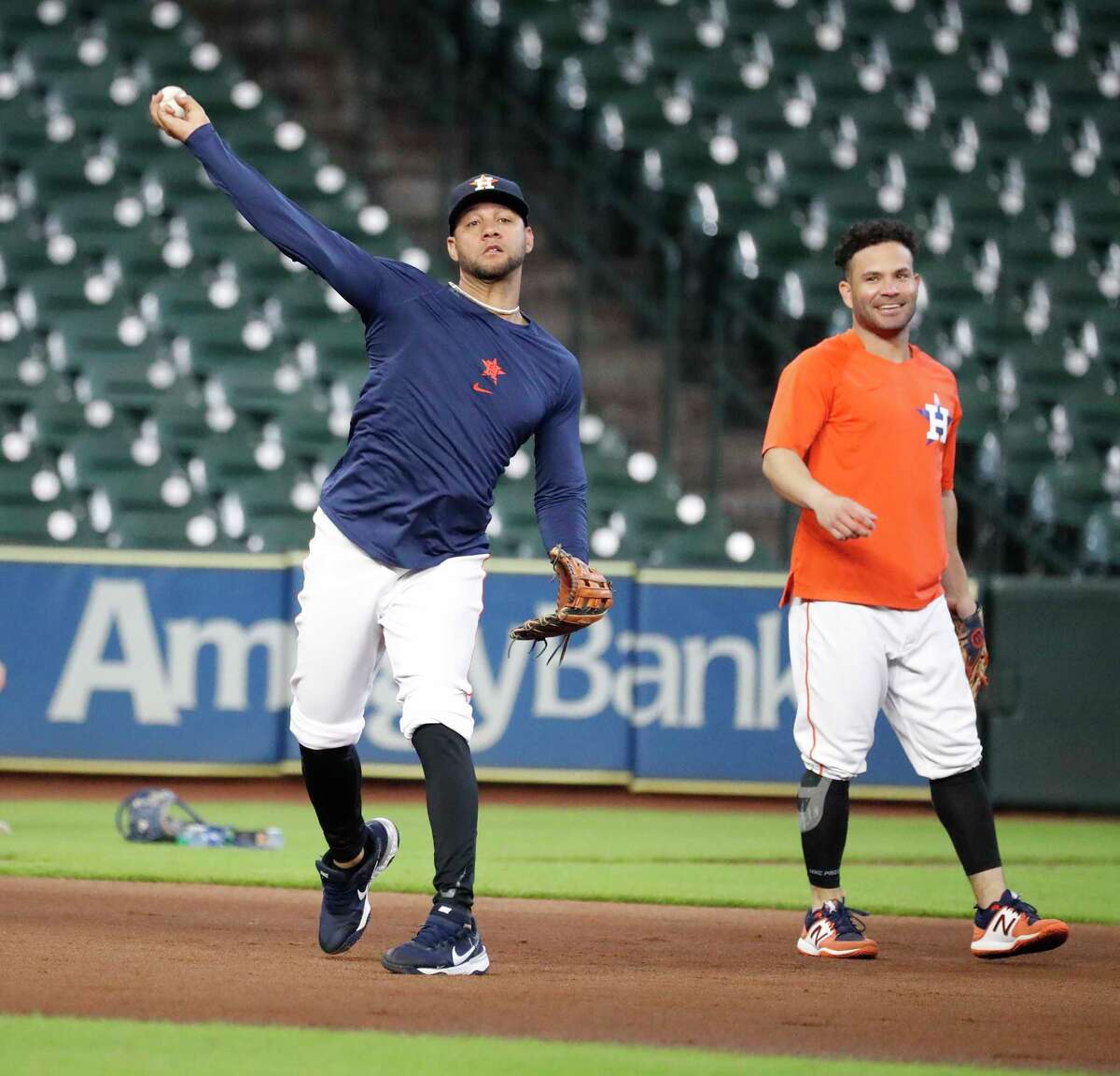 Houston Astros first baseman Yuli Gurriel (10) throws from third base during infield drills before the start of an MLB baseball game at Minute Maid Park, Saturday, August 21, 2021, in Houston.