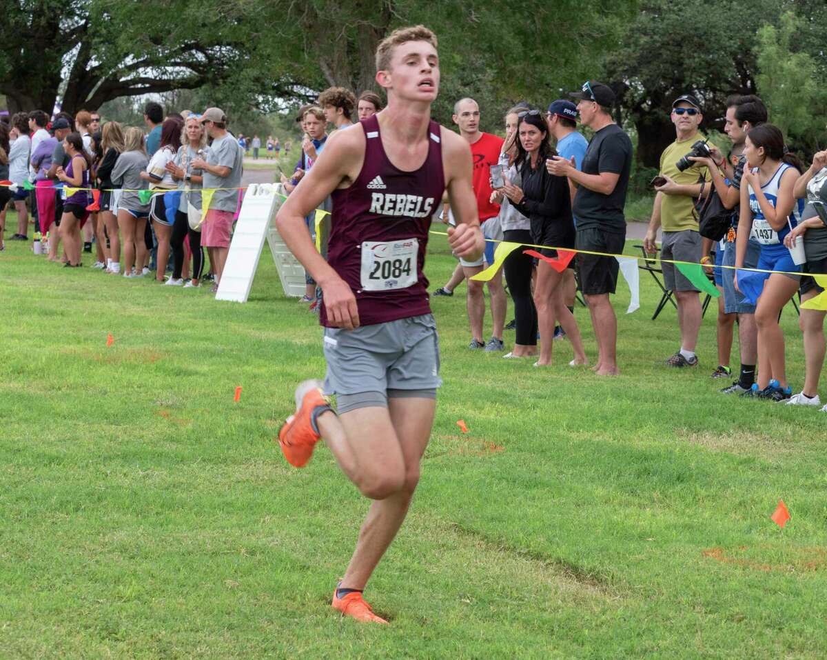 Division 1 boys Bridger Bowcutt, Legacy High, finishes third as he runs down to the finish 08/21/2021 around Hogan Park and Sibley Nature Center for the Tall City Invitational cross-country meet. Tim Fischer/Reporter-Telegram
