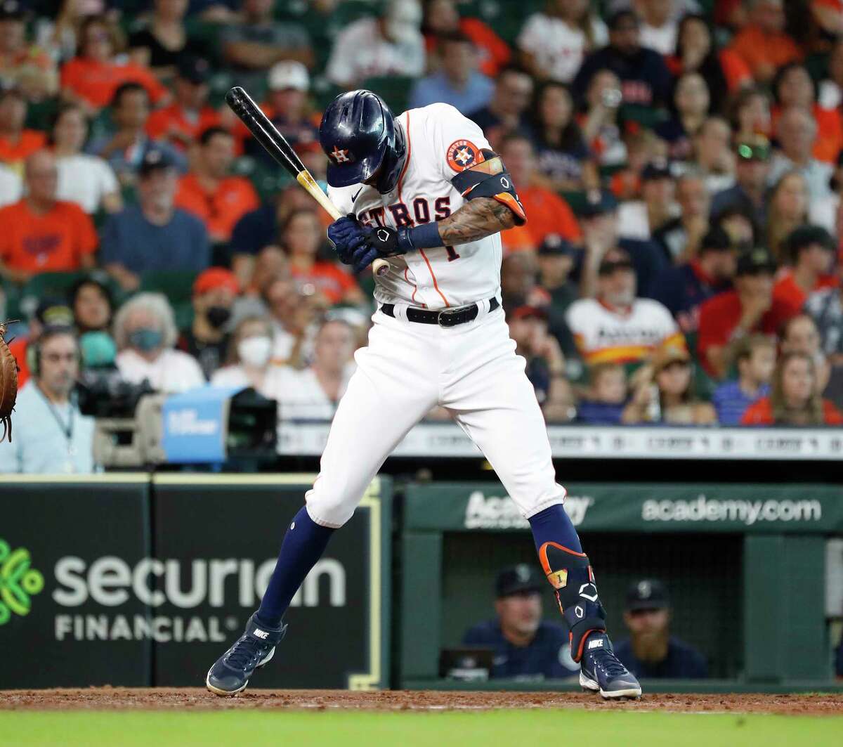 Houston Astros Carlos Correa (1) jumps back from a pitch inside from Seattle Mariners starting pitcher Logan Gilbert during the third inning of an MLB baseball game at Minute Maid Park, Saturday, August 21, 2021, in Houston.