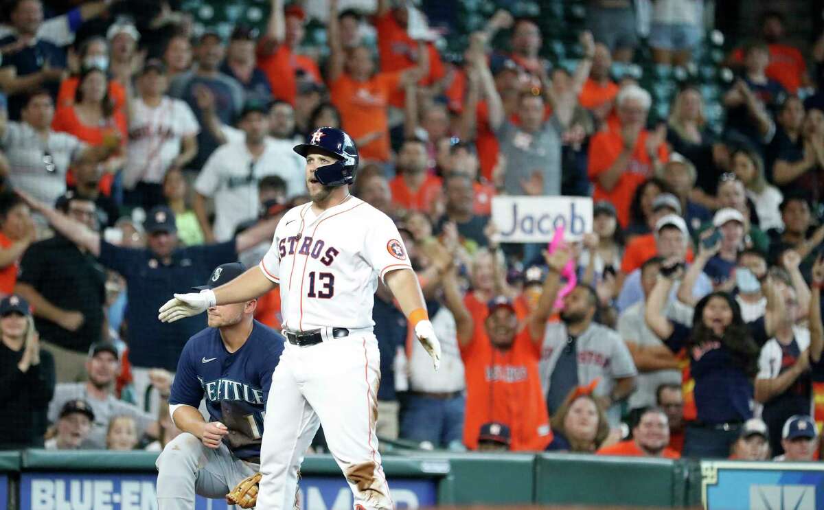 Houston Astros Jacob Wilson (13) stands on third base after hitting a triple off Seattle Mariners starting pitcher Logan Gilbert during the third inning of an MLB baseball game at Minute Maid Park, Saturday, August 21, 2021, in Houston.