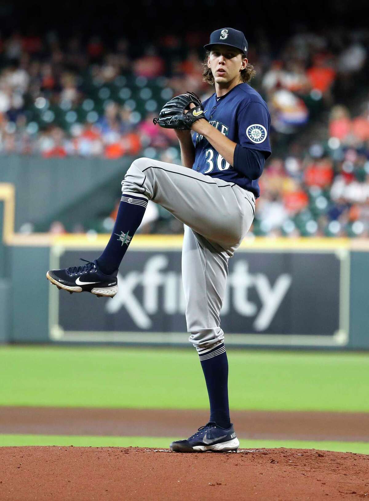 Seattle Mariners starting pitcher Logan Gilbert (36) pitches to Houston Astros Jose Altuve during the first inning of an MLB baseball game at Minute Maid Park, Saturday, August 21, 2021, in Houston.