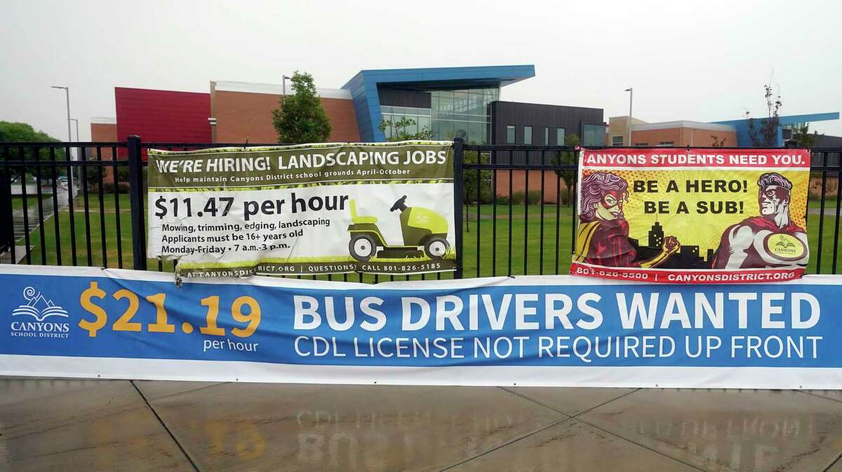 A "Bus Drivers Wanted" sign is shown Wednesday, Aug. 18, 2021, in Sandy, Utah. A shortage of bus drivers is complicating the start of a new school year already facing a surge in COVID-19 cases and conflicts over whether masks should be required in school buildings.