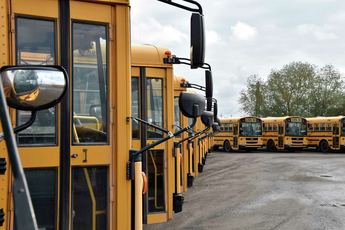 School buses parked in Helena, Mont., ahead of the beginning of the school year, Friday, Aug. 20, 2021. School districts across the country are coping with a shortage of bus drivers, a dilemma that comes even as they struggle to start a new school year during a new surge of the coronavirus pandemic.