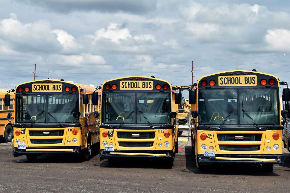 School buses parked in Helena, Mont., ahead of the beginning of the school year, Friday, Aug. 20, 2021. School districts across the country are coping with a shortage of bus drivers, a dilemma that comes even as they struggle to start a new school year during a new surge of the coronavirus pandemic.