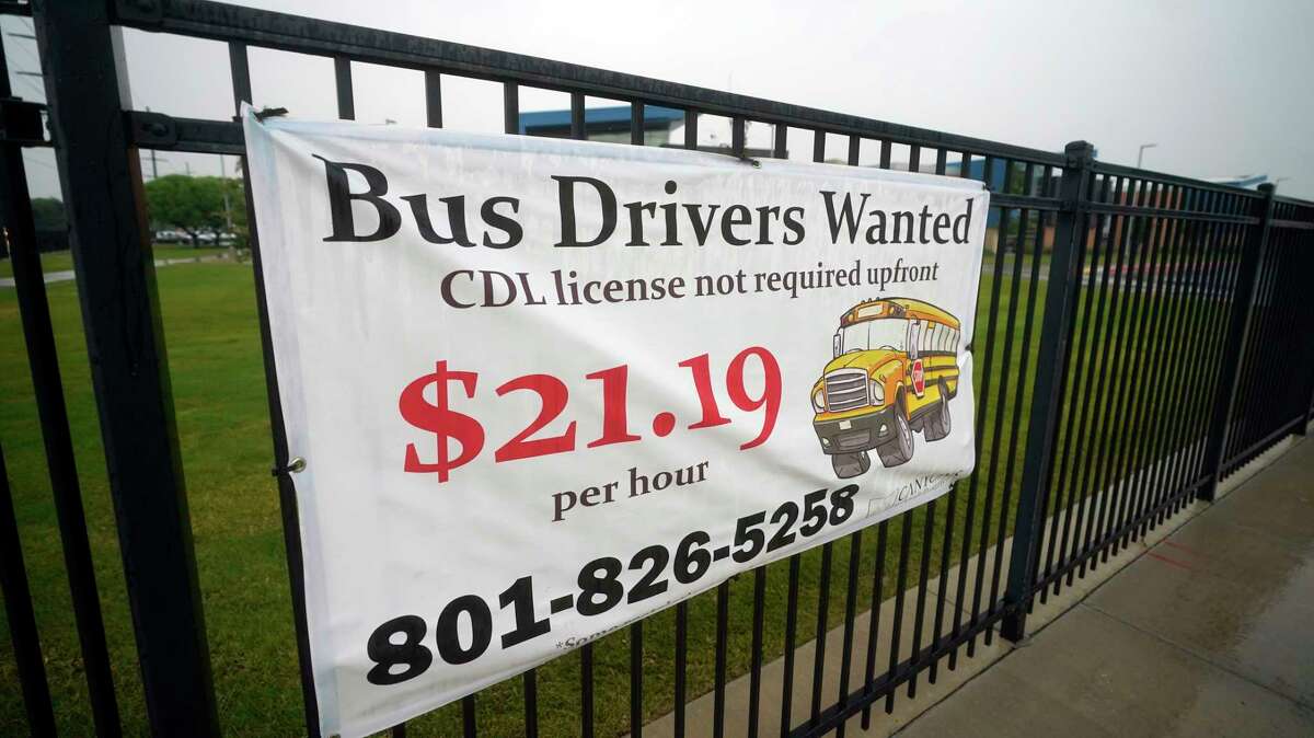 A "Bus Drivers Wanted" sign is shown Wednesday, Aug. 18, 2021, in Sandy, Utah. A shortage of bus drivers is complicating the start of a new school year already facing a surge in COVID-19 cases and conflicts over whether masks should be required in school buildings.
